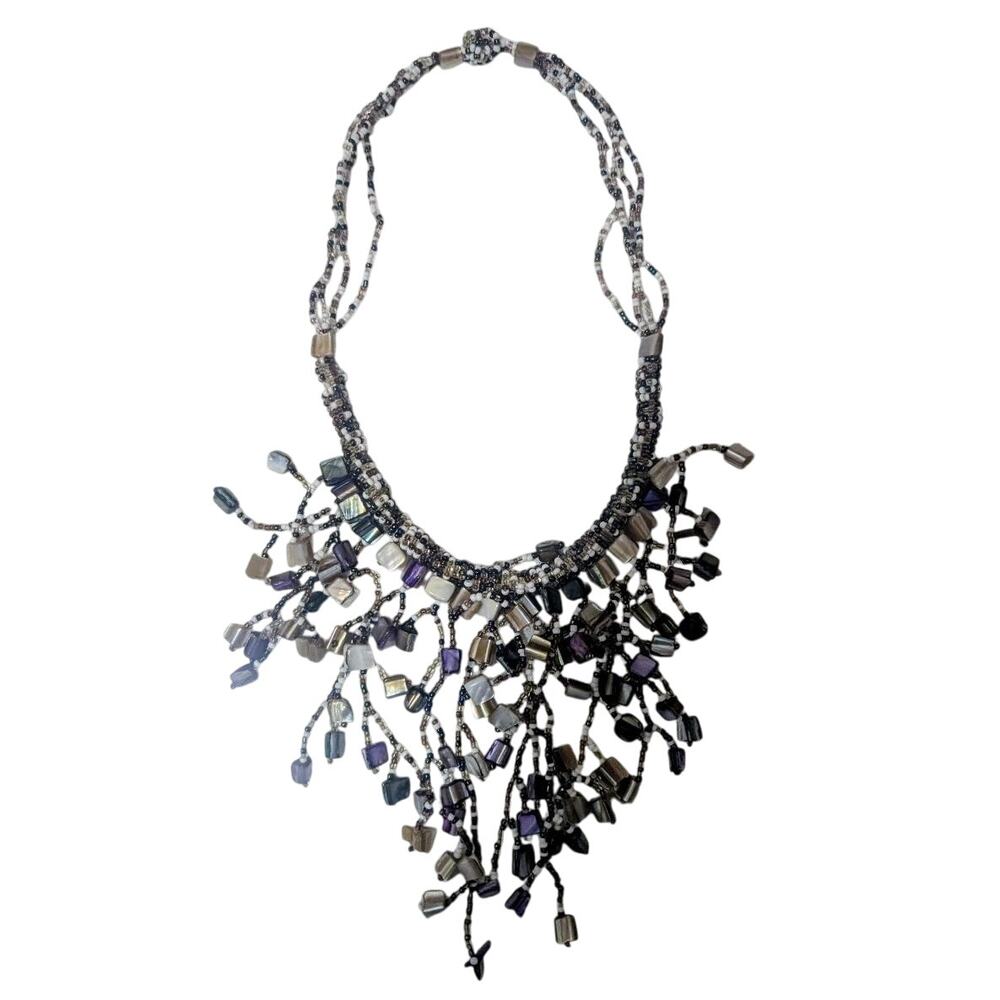 Vintage 18 inch beaded necklace. Beautiful purple, black, white.
